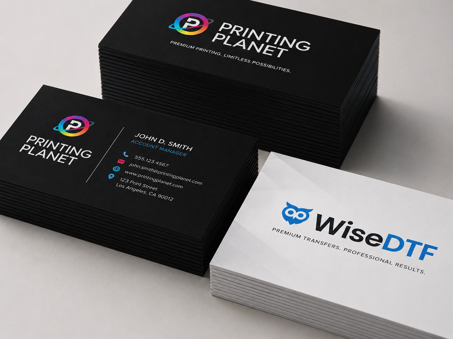 Stack of professional business cards with rainbow CMYK logo on dark background